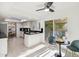 Open kitchen featuring a breakfast nook, dark countertops, tile floors, and white cabinets at 8405 E San Pedro Dr, Scottsdale, AZ 85258