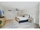 Bright bedroom with a ceiling fan and white walls, offering a serene space at 8405 E San Pedro Dr, Scottsdale, AZ 85258