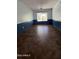 Clean dining room with tile floor, two-toned walls, ceiling lamp, and large window at 8618 N 45Th Dr, Glendale, AZ 85302