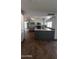Eat-in kitchen featuring white cabinets, island with a sink, and updated appliances at 8618 N 45Th Dr, Glendale, AZ 85302