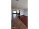 Spacious living room featuring two-toned walls, new flooring, and ample natural light at 8618 N 45Th Dr, Glendale, AZ 85302