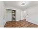 Bright bedroom featuring hardwood floors, modern lighting and a custom closet at 8701 E Sage Dr, Scottsdale, AZ 85250