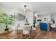 Cozy dining area with modern lighting adjacent to an open concept kitchen at 8701 E Sage Dr, Scottsdale, AZ 85250