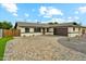 Charming single-story home with a beautifully paved driveway and desert landscaping at 8701 E Sage Dr, Scottsdale, AZ 85250