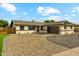 Charming single-story home with a beautifully paved driveway and desert landscaping at 8701 E Sage Dr, Scottsdale, AZ 85250