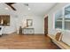 Inviting foyer area with hardwood floors, natural light, and stylish décor at 8701 E Sage Dr, Scottsdale, AZ 85250