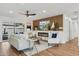 Comfortable living room with modern fireplace, custom built-ins, and access to the backyard at 8701 E Sage Dr, Scottsdale, AZ 85250