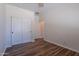 Bedroom with wood-look floors and a closet with sliding doors at 900 E Harrison St, Chandler, AZ 85225