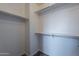A closet features ample shelving space and wood-look floors at 900 E Harrison St, Chandler, AZ 85225