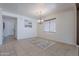 Dining room features a chandelier, tiled floors, and a large window for natural light at 900 E Harrison St, Chandler, AZ 85225