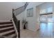 Inviting entryway with carpeted stairs, tile flooring, and decorative accents at 900 E Harrison St, Chandler, AZ 85225