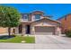 Charming two-story home featuring a well-manicured lawn and a spacious two-car garage at 900 E Harrison St, Chandler, AZ 85225