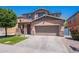 Inviting two-story home with a spacious driveway and desert landscaping at 900 E Harrison St, Chandler, AZ 85225