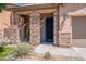 Charming front porch with stone pillars and blue front door at 900 E Harrison St, Chandler, AZ 85225
