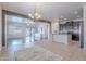 Open-concept kitchen with a large island, pendant lighting, and sightlines to the living room at 900 E Harrison St, Chandler, AZ 85225
