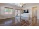 Bright living room features hardwood floors, sliding glass door, large windows and ceiling fan at 900 E Harrison St, Chandler, AZ 85225
