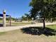 Serene park with lush green grass, mature trees, and shaded picnic areas at 900 E Harrison St, Chandler, AZ 85225
