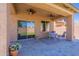 Covered patio featuring tile flooring, dual ceiling fans, and views of the backyard at 900 E Harrison St, Chandler, AZ 85225