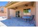 Cozy covered patio with a ceiling fan and paved flooring is perfect for entertaining at 900 E Harrison St, Chandler, AZ 85225