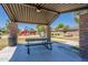 Covered picnic area in neighborhood park with table and playground at 900 E Harrison St, Chandler, AZ 85225