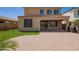 Stunning backyard featuring manicured landscaping, a spacious patio, and a seamless extension of the home at 9764 E Radioactive Dr, Mesa, AZ 85212