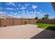Spacious backyard with a large brick patio area and manicured artificial turf under a clear blue sky at 9764 E Radioactive Dr, Mesa, AZ 85212