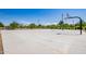 Outdoor basketball court with multiple hoops surrounded by greenery and clear blue skies at 9764 E Radioactive Dr, Mesa, AZ 85212