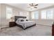 Bright bedroom with windows and carpet flooring. Ceiling fan is also installed at 9764 E Radioactive Dr, Mesa, AZ 85212