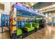 Interior of an old-fashioned bus transformed into a seating area with green cushioned booths at 9764 E Radioactive Dr, Mesa, AZ 85212