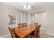 View of the dining room that features a view into the adjacent room and a wooden table at 9764 E Radioactive Dr, Mesa, AZ 85212