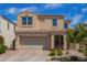 Charming two-story home with a tile roof, manicured landscaping, and an attached two-car garage at 9764 E Radioactive Dr, Mesa, AZ 85212