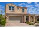 Charming two-story home with a tile roof, manicured landscaping, and an attached two-car garage at 9764 E Radioactive Dr, Mesa, AZ 85212