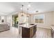 Beautiful kitchen island featuring pendant lighting, stainless steel appliances, and barstool seating at 9764 E Radioactive Dr, Mesa, AZ 85212