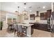 Spacious eat-in kitchen with a view of the dining area and lots of natural light at 9764 E Radioactive Dr, Mesa, AZ 85212