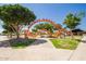 Orange Monster themed playground with climbing structures and mature trees in a Gathering-friendly neighborhood at 9764 E Radioactive Dr, Mesa, AZ 85212