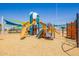 Modern playground with slides, climbing structures, and shade canopies for children at 9764 E Radioactive Dr, Mesa, AZ 85212