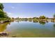 Picturesque community pond surrounded by lush landscaping, offering a serene and tranquil setting at 9764 E Radioactive Dr, Mesa, AZ 85212