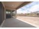 Covered back patio with smooth concrete and a spacious backyard, great for entertaining at 9775 S 36Th Ln, Laveen, AZ 85339