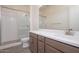 Bright bathroom featuring a glass-enclosed shower, stylish vanity, and modern fixtures at 9775 S 36Th Ln, Laveen, AZ 85339