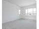 Spacious bedroom with neutral carpeting and plenty of natural light at 9775 S 36Th Ln, Laveen, AZ 85339