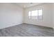 Well-lit bedroom featuring a large window and neutral walls at 9775 S 36Th Ln, Laveen, AZ 85339