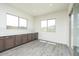 Bright dining area with white walls, tile floors, and large windows offering views of the mountains at 9775 S 36Th Ln, Laveen, AZ 85339