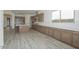 Well-designed kitchen with an island, stainless steel appliances, and wood cabinetry in an open layout at 9775 S 36Th Ln, Laveen, AZ 85339