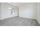 Neutral living room featuring a large window and recessed lighting at 9775 S 36Th Ln, Laveen, AZ 85339