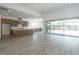 Bright, open living space featuring a kitchen with an island, tile floors, and sliding glass doors at 9775 S 36Th Ln, Laveen, AZ 85339