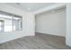 Open-concept living area with tile floors, large windows, and abundant natural light at 9775 S 36Th Ln, Laveen, AZ 85339