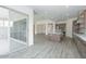 Open floor plan showcasing the kitchen with a large island, stainless appliances and sliding glass doors at 9775 S 36Th Ln, Laveen, AZ 85339