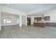 Open-concept floor plan featuring tile flooring and a kitchen with modern appliances and a large island at 9775 S 36Th Ln, Laveen, AZ 85339