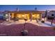 Spacious covered patio perfect for entertaining, complete with ample seating, a grill, and desert landscaping at 12928 W Santa Ynez Dr, Sun City West, AZ 85375