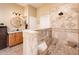 Bathroom with dual sinks and tiled stand-up shower at 12928 W Santa Ynez Dr, Sun City West, AZ 85375